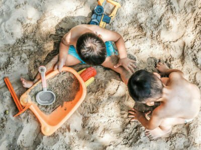 Children playing in the sand on a Bali beach