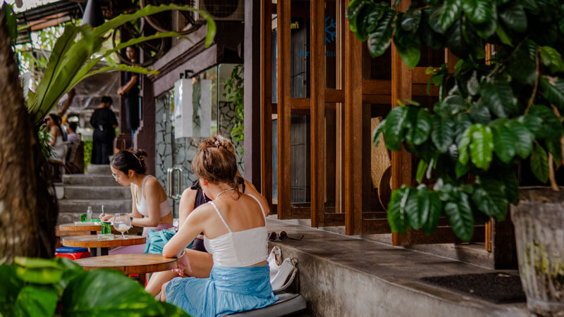 Tourists enjoy coffee at Seniman Coffee Studio, one of the Top 10 Budget-Friendly Hangout Spots in Ubud.