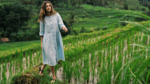 Tourist walking through Jatiluwih Rice Terraces in Bali