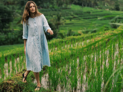 Tourist walking through Jatiluwih Rice Terraces in Bali