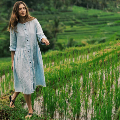 Tourist walking through Jatiluwih Rice Terraces in Bali