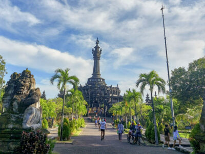 Bajra Sandhi Monument in Denpasar Bali, a towering structure amidst tropical greenery symbolizing Balinese struggle for independence.