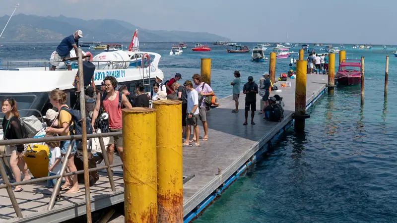 Tourists arriving at Gili Trawangan port from a fast boat