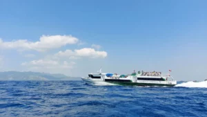 A fast boat speeding across the clear blue waters from Bali to Gili Trawangan.