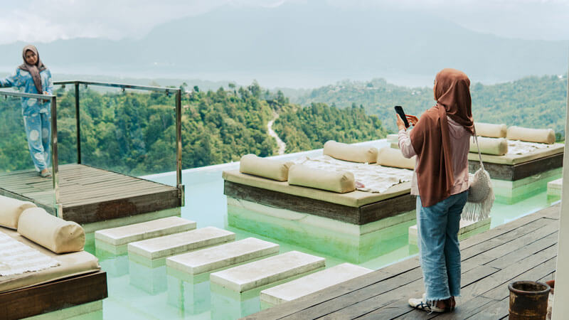 Tourists enjoying panoramic views at a Kintamani viewpoint