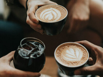 Friends enjoying coffee at a beachside cafe in Tanjung Benoa, Bali