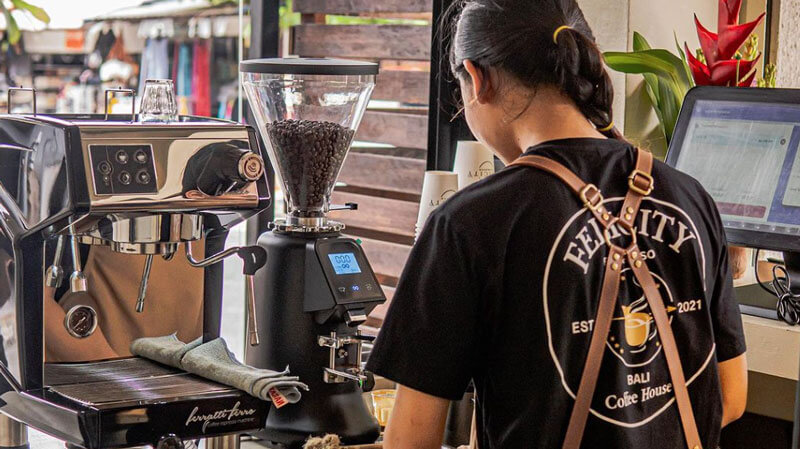 Barista preparing coffee at Felicity Espresso Seminyak.