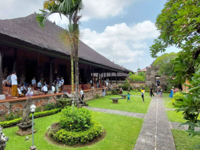 View of the Bali Museum grounds with visitors and traditional architecture.