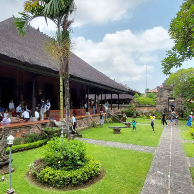 View of the Bali Museum grounds with visitors and traditional architecture.