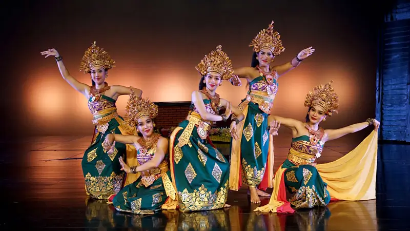 Devdan Show Bali performers in traditional Janger dance costumes showcasing a vibrant cultural performance on stage. Image Credit: © Devdan