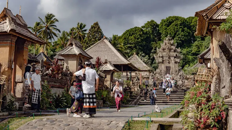 Tourists exploring Penglipuran Village in Bali, one of the best places to visit in Bali.