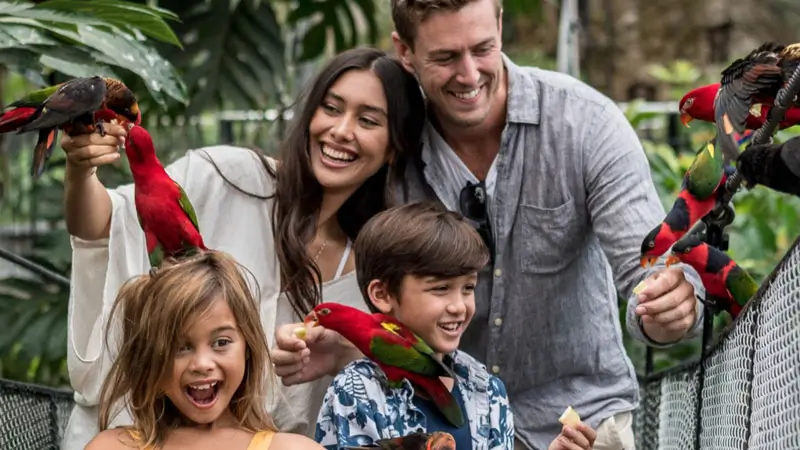 Children and families interact with birds at Bali Bird Park, Ubud.