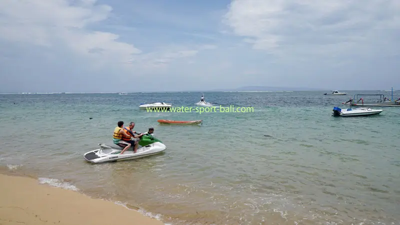 Jet ski activities at Sanur Beach, Bali with a blue sea background and maximum safety for families