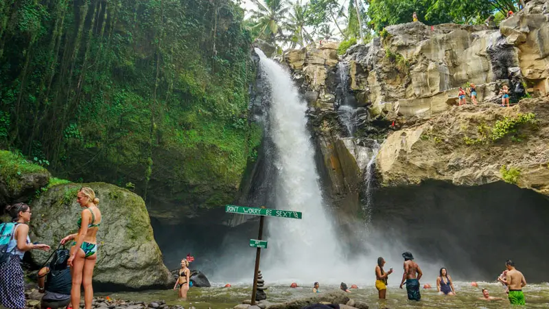 Tourists enjoy the beauty of Tegenungan Waterfall in Ubud.