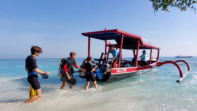 Tourists prepare for scuba diving on Gili Trawangan