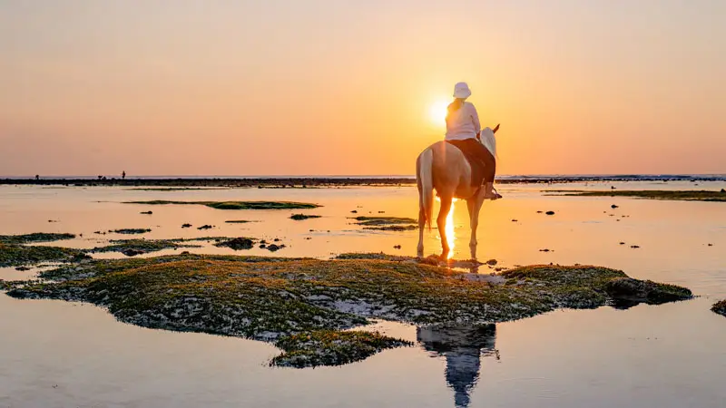 Horse riding at sunset on Gili Trawangan beach.