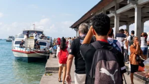 Tourists prepare to board a fast boat at Padang Bai Harbor