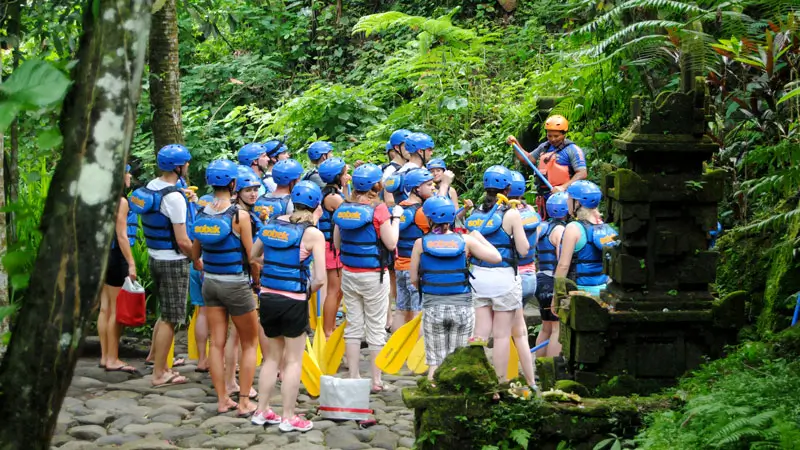 Tourists receive a safety briefing before rafting on the Ayung River, Bali