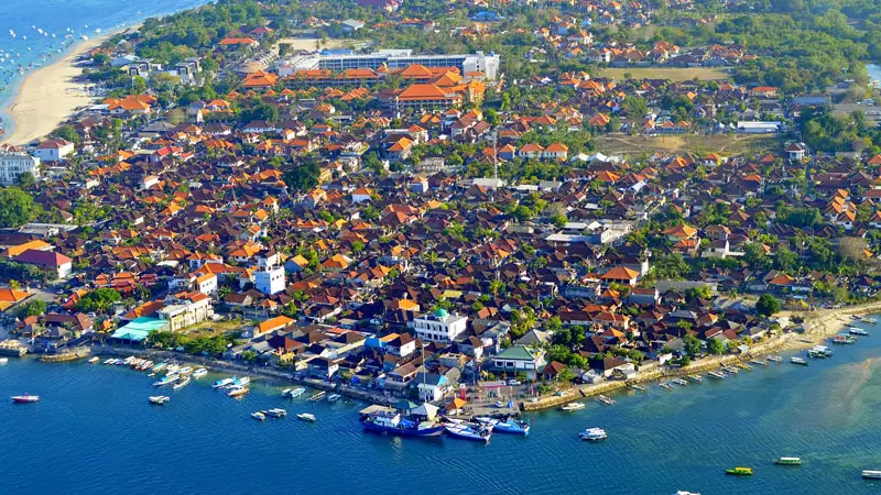 Aerial view of Nusa Dua Beach flying with parasailing.