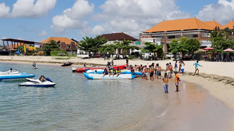 Tourists enjoy the Banana Boat activity Tanjung Benoa watersport Bali