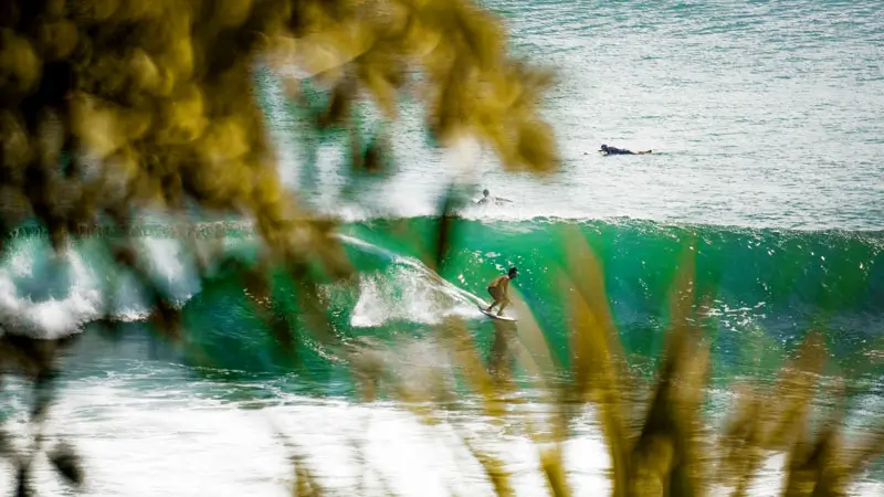 Professional surfers conquer big waves at Uluwatu Beach