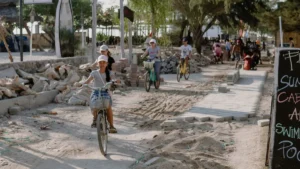 Tourists cycling on sandy paths in Gili Trawangan, Indonesia