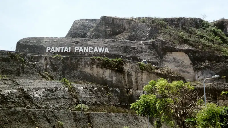 Iconic sign carved into limestone cliffs in Kutuh Village.