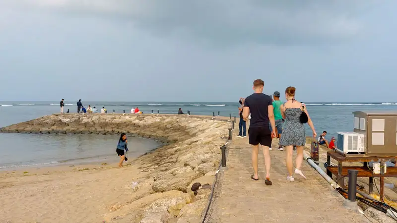 Visitors strolling along the pathway during the afternoon.